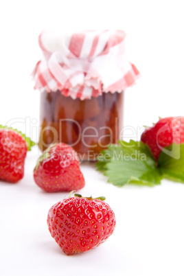 deliscious strawberry jam with fresh fruits isolated