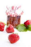 deliscious strawberry jam with fresh fruits isolated
