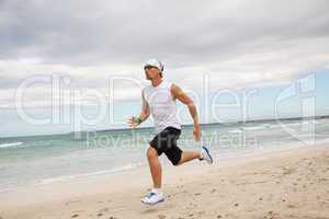 man is jogging on the beach summertime sport fitness