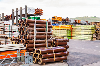 Several pipes stacked in yard