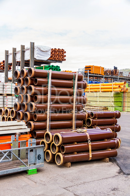 Several pipes stacked in yard