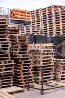 Stacks of old wooden pallets in a yard