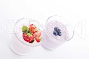 fresh tasty strawberry blueberry yoghurt shake cream isolated