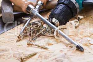 Drill with timber, screwdrivers and screws