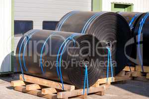 Rolls of black industrial plastic