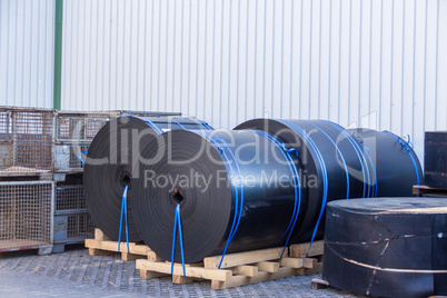 Rolls of black industrial plastic
