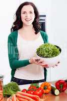 young woman cooking vegetarian food