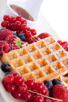 sweet fresh tasty waffles with mixed fruits isolated