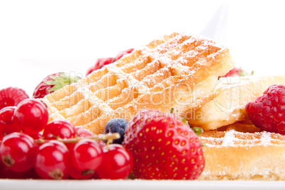 sweet fresh tasty waffles with mixed fruits isolated