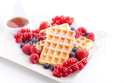 sweet fresh tasty waffles with mixed fruits isolated