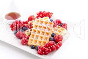 sweet fresh tasty waffles with mixed fruits isolated