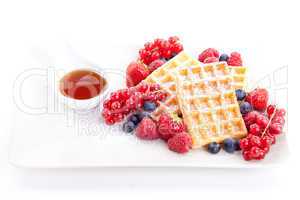 sweet fresh tasty waffles with mixed fruits isolated