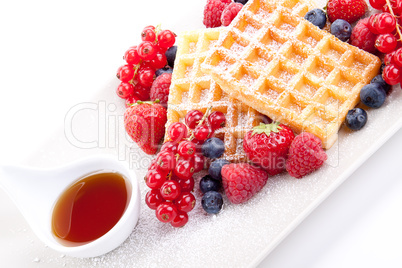 sweet fresh tasty waffles with mixed fruits isolated