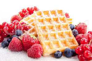 sweet fresh tasty waffles with mixed fruits isolated