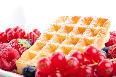 sweet fresh tasty waffles with mixed fruits isolated