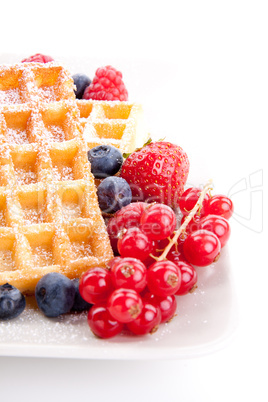 sweet fresh tasty waffles with mixed fruits isolated