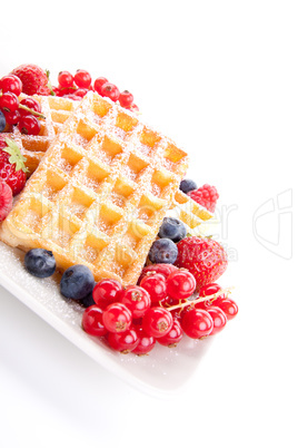 sweet fresh tasty waffles with mixed fruits isolated