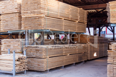 Wooden panels stored inside a warehouse