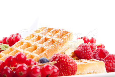 sweet fresh tasty waffles with mixed fruits isolated