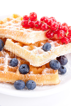 sweet fresh tasty waffles with mixed fruits isolated