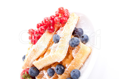 sweet fresh tasty waffles with mixed fruits isolated