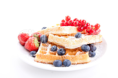 sweet fresh tasty waffles with mixed fruits isolated