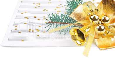 Christmas decorations and music sheet isolated on white backgrou