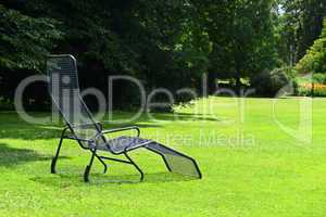 Chaise lounge on the green grass
