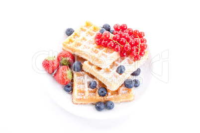 sweet fresh tasty waffles with mixed fruits isolated