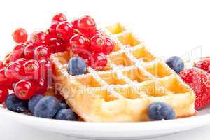 sweet fresh tasty waffles with mixed fruits isolated