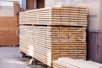 Wooden panels stored inside a warehouse