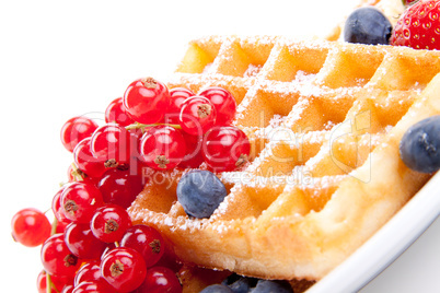 sweet fresh tasty waffles with mixed fruits isolated