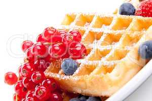 sweet fresh tasty waffles with mixed fruits isolated