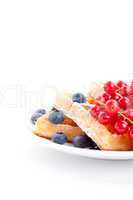 sweet fresh tasty waffles with mixed fruits isolated