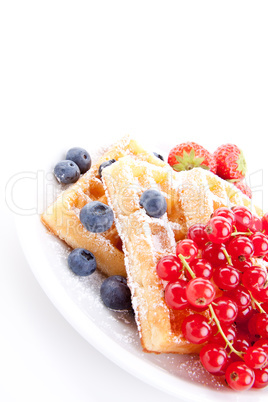 sweet fresh tasty waffles with mixed fruits isolated