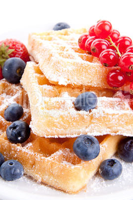 sweet fresh tasty waffles with mixed fruits isolated