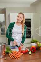 young woman cooking vegetarian food