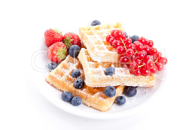 sweet fresh tasty waffles with mixed fruits isolated