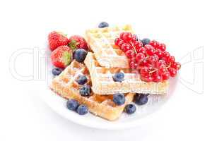 sweet fresh tasty waffles with mixed fruits isolated