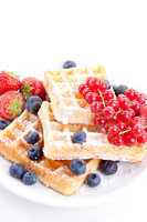 sweet fresh tasty waffles with mixed fruits isolated