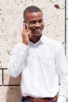 young successfil african businessman with mobilephone