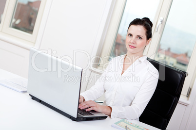 smiling young female callcenter agent with headset