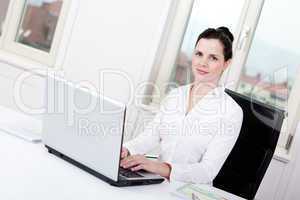 smiling young female callcenter agent with headset