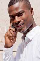 young successfil african businessman with mobilephone