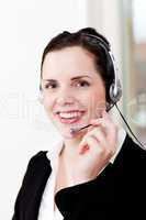 smiling young female callcenter agent with headset