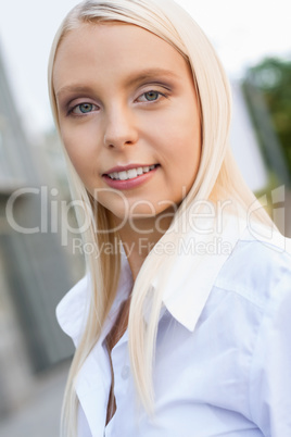 attractive young successful smiling business woman standing outdoor