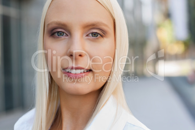 attractive young successful smiling business woman standing outdoor