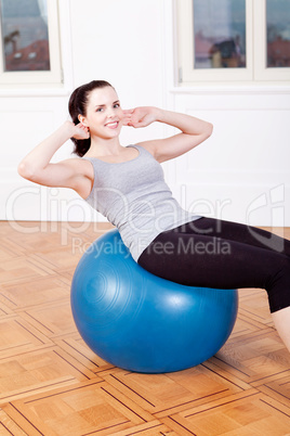 attractive young woman doing sit ups