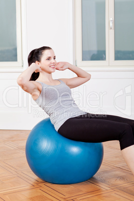 attractive young woman doing sit ups