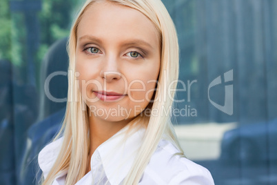 attractive young successful smiling business woman standing outdoor